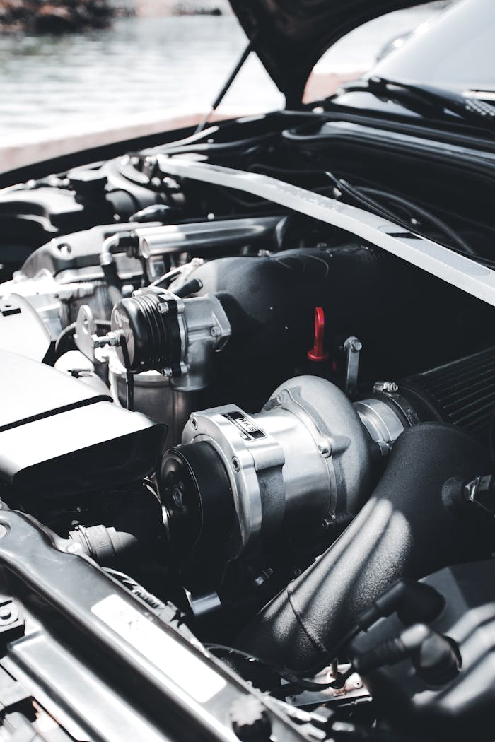 Detailed view of a car engine highlighting mechanical components and structure.